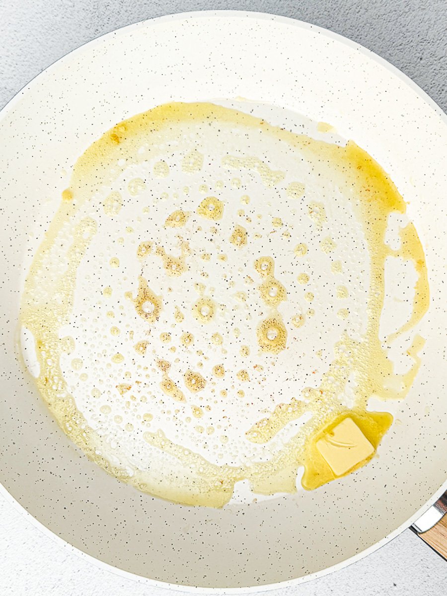 melting butter in hot white pan
