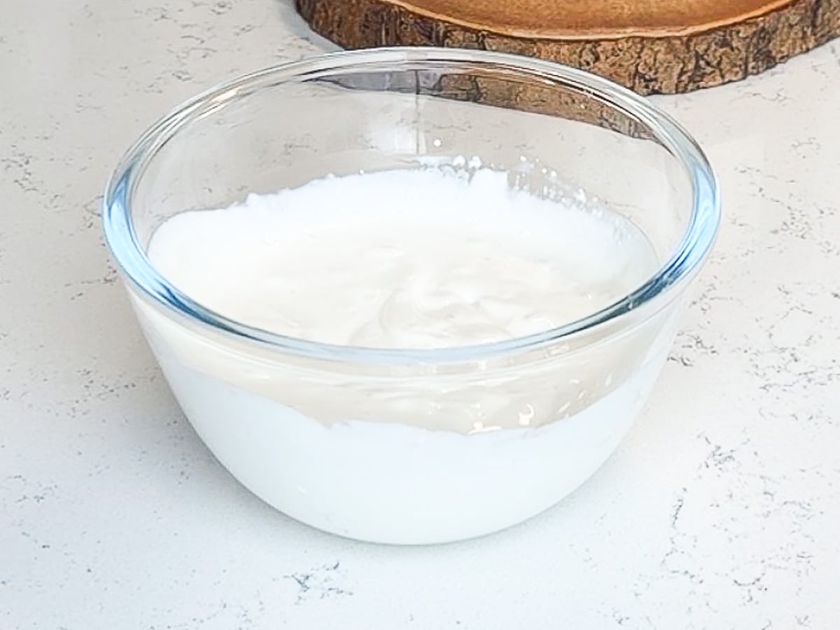 blended cottage cheese in glass mixing bowl