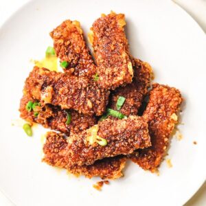 Copycat Chillis Nashville hot Mozzarella Sticks on white plate.